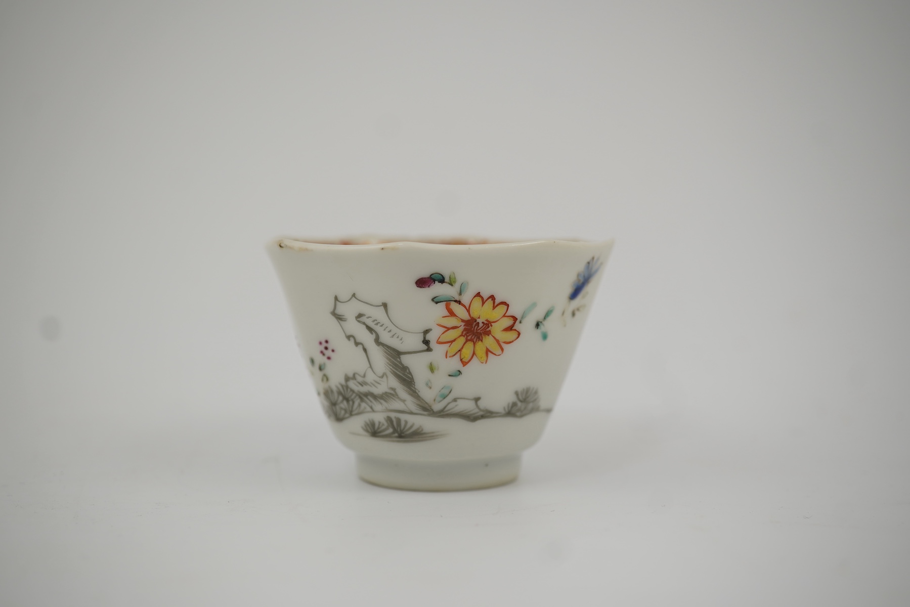 Two Chinese semi-eggshell porcelain hexagonal saucers and a similar cup, Yongzheng/Qianlong period